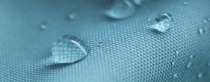 Water drops on blue waterproof nylon fabric